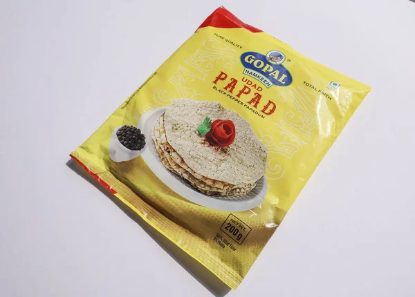 Sarı renkli Gopal marka Urad papad paketi. Papad snacks urad dal with black pepper on 12, December 2023 from India