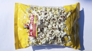 Mr.Popcorn brand, crunchy and fluffy Butter flavoured Popcorns in plastic bag clipart