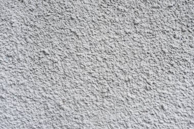 Sert beyaz desenli duvar, arka plan veya tasarım çalışmaları için uygun, düzensiz yüzeyinin detaylı bir yakın çekimini sağlar. Eşsiz yapı ve basitlik, yaratıcı projeler için idealdir..