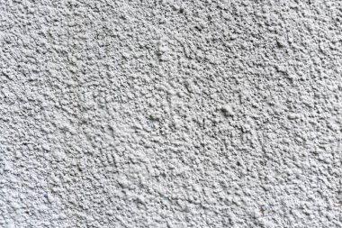 Sert beyaz desenli duvar, arka plan veya tasarım çalışmaları için uygun, düzensiz yüzeyinin detaylı bir yakın çekimini sağlar. Eşsiz yapı ve basitlik, yaratıcı projeler için idealdir..