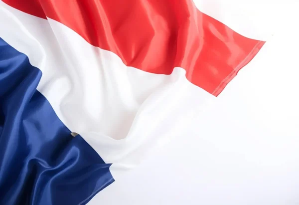 Flag of France waving over a white  background waving in the wind.