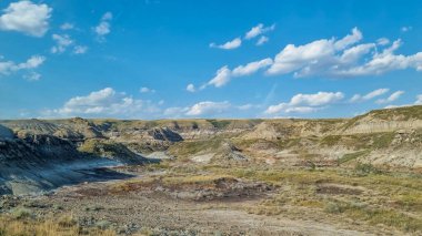 Drumheller, Alberta, Canada - August 06 2024: Area of the badlands as viewed from the viewing platform near the Royal Tyrrell Museum in Drumheller, Alberta. clipart