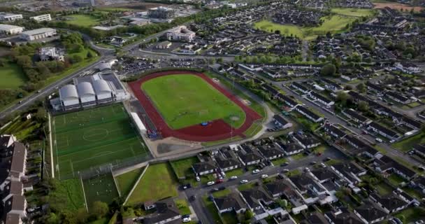 Aerial Circular Flight Football Field Small Town Ireland Footage — Stock Video