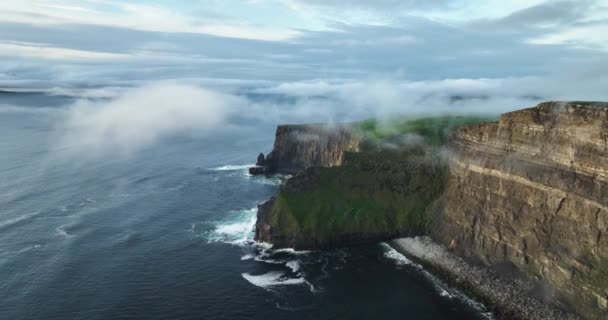 Aerial Footage Coastal Cliffs Shrouded Low Clouds Picturesque Golden Hour — Stock Video