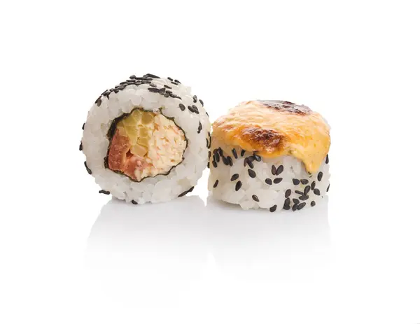 stock image A pair of sushi rolls features a creamy filling topped with melted cheese, garnished with black sesame seeds, all set against a bright white background.