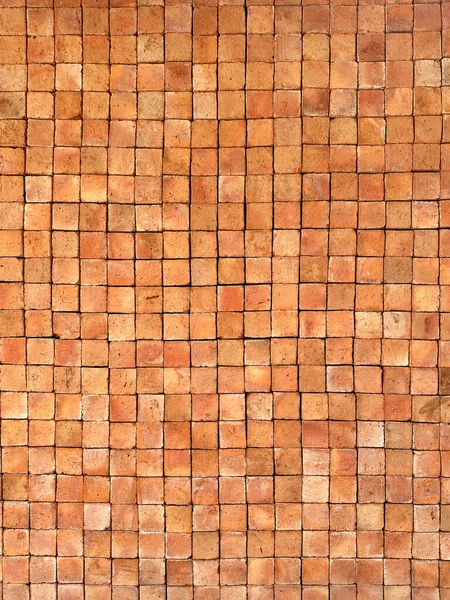 Turuncu ve kahverengi tuğlalı arka plan dokusu ve duvar kağıdı. Dış duvar dekorasyonu ve tasarımı.