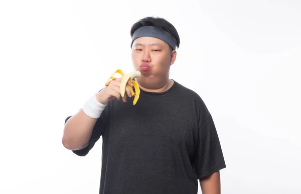 Young Asian Funny Fat Sport Man Eating Banana Isolated White — Stock Photo, Image