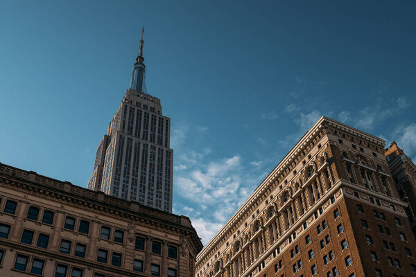 Sunlight casts a majestic glow on the iconic Empire State Building.