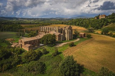 Aerial view of the abbey of San Galgano: is located about 25 miles from Siena, in southern Tuscany, Italy, Siena region - September, 2022 clipart