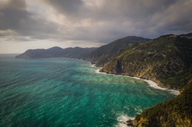 Beautiful view of of rocky mountainous coast and blue sea near Corniglia, Italy. September 2022, aerial drone picture