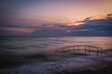 Sunrise on the beach of the city of Campofelice di Rosaria in northwestern Sicily. August 2024. Long exposure picture. clipart