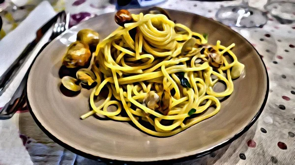 A plate of spaghetti with Mediterranean clams ready to be eaten.