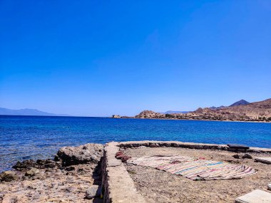 Cottage in a Bedouin Camp on the Sea in Ras Shitan in Oasis in Sinai, Taba desert with the Background of the Sea and Mountains.