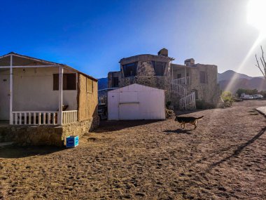 Cottage in a Bedouin Camp on the Sea in Ras Shitan in Oasis in Sinai, Taba desert with the Background of the Sea and Mountains.