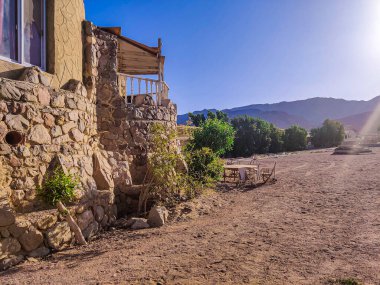 Cottage in a Bedouin Camp on the Sea in Ras Shitan in Oasis in Sinai, Taba desert with the Background of the Sea and Mountains.