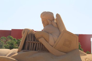 Sculptures made of sand for famous historical and ancient figures clipart