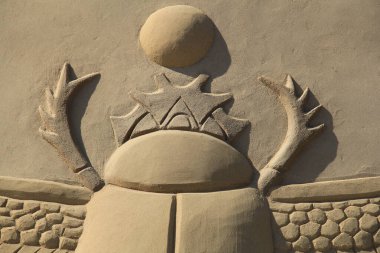 Sculptures made of sand for famous historical and ancient figures clipart