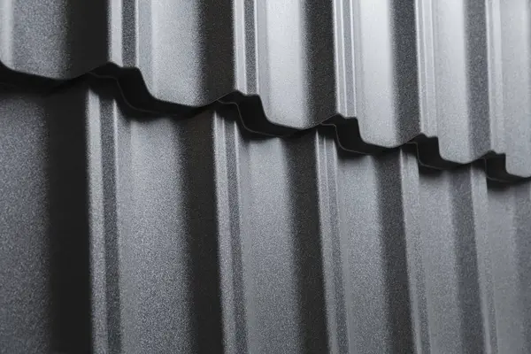 stock image Close-up view modular tile effect roof panel. Lightweight galvanised steel roofing sheet. Traditional metal shingle tiles. Popular profiled metallic pantile mimic clay or concrete slate