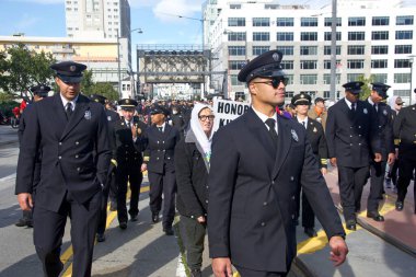 San Francisco, CA - Jan 16, 2023: Unidentified participants in Martin Luther King March from Caltrain station down 4th St over the bridge then up 3rd St over the bridge to Yerba Buena Garden