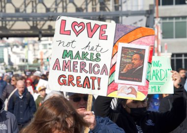 San Francisco, CA - Jan 16, 2023: Unidentified participants in Martin Luther King March from Caltrain station down 4th St over the bridge then up 3rd St over the bridge to Yerba Buena Garden