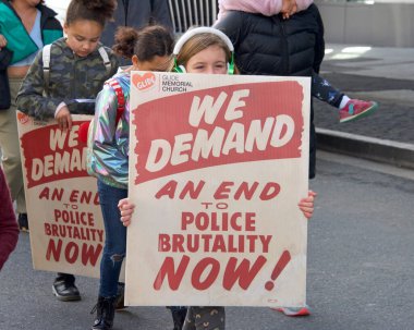 San Francisco, CA - Jan 16, 2023: Unidentified participants in Martin Luther King March from Caltrain station down 4th St over the bridge then up 3rd St over the bridge to Yerba Buena Garden