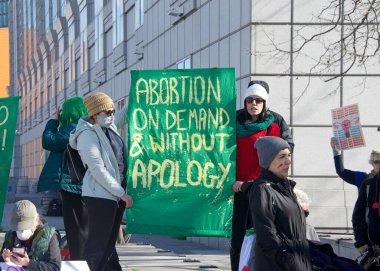 San Francisco, CA - Jan 21, 2023: Unidentified pro-choice counter protestors at the annual March for Life, holding pro-choice signs and banners across from Civic Center