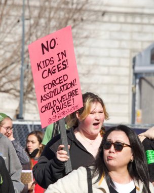 San Francisco, CA - Jan 21, 2023: Unidentified pro-choice counter protestors at the annual March for Life, holding pro-choice signs and banners across from Civic Center