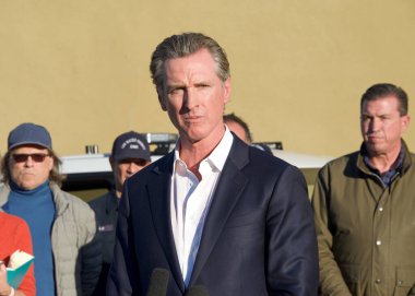 Half Moon Bay, CA - Jan 24, 2023: California Governor Gavin Newsom speaking at a Press Conference in the aftermath of  mass shootings. clipart