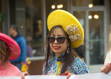Oakland, CA - Jan 29, 2023: Participants in the first annual Lunar New Year Parade in Oakland. Little Saigon Vietnamese community participants holding a banner.