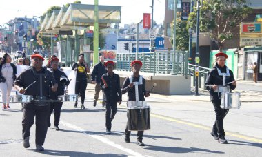 San Francisco, CA - Feb 18, 2023: Participants in the Black History Parade, going down 3rd Street in the Bayview Hunters Point neighborhood.