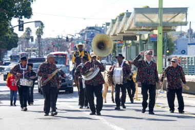 San Francisco, CA - Feb 18, 2023: Participants in the Black History Parade, going down 3rd Street in the Bayview Hunters Point neighborhood.