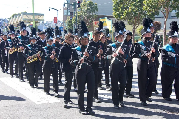 San Francisco, CA - Feb 18, 2023: Phillip Burton HIgh School Puma Band in the Black History Parade, walking down 3rd Street in the Bayview Hunters Point neighborhood.