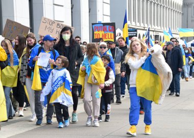 San Francisco, CA - Feb 25, 2023: Participants at Unite for Ukraine March from Harry Bridges Plaza on the Embarcadero to Pier 39.