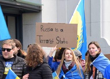 San Francisco, CA - Feb 25, 2023: Participants at Unite for Ukraine March from Harry Bridges Plaza on the Embarcadero to Pier 39.