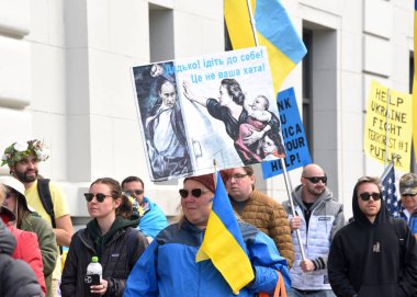 San Francisco, CA - Feb 25, 2023: Participants at Unite for Ukraine March from Harry Bridges Plaza on the Embarcadero to Pier 39.