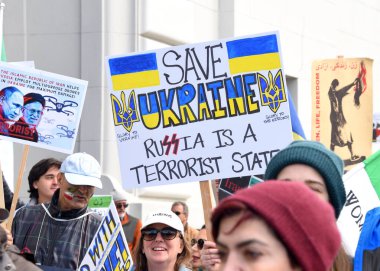 San Francisco, CA - Feb 25, 2023: Participants at Unite for Ukraine March from Harry Bridges Plaza on the Embarcadero to Pier 39.
