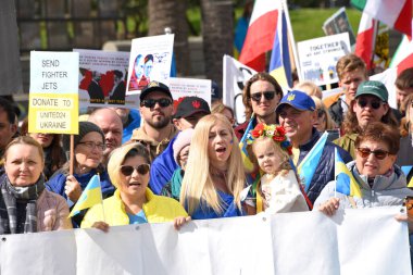 San Francisco, CA - Feb 25, 2023: Participants at Unite for Ukraine Rally at Harry Bridges Plaza on the Embarcadero, organized by the Ukrainian American Coordinating council.