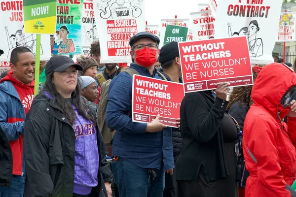 stock image Oakland, CA - May 8, 2023: Hundreds of Teachers, Parents and Supporters marching at a Teacher Strike Rally Day three in the Highland section of Oakland.
