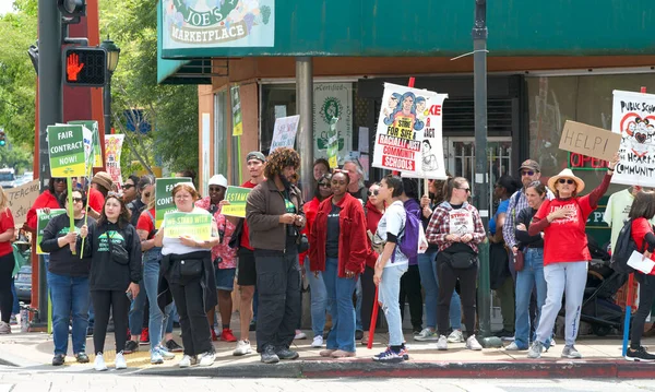 stock image Oakland, CA - May 9, 2023: Teachers, Parents and Supporters holding banners and signs at  Teacher Strike Day Four at the corner of 35th street and MacArthur Blvd