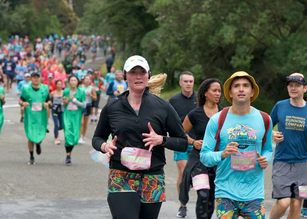 stock image San Francisco, CA - May 21, 2023: Participants in the annual Bay to Breakers race through San Francisco. Running through Golden Gate Park towards the Finish Line.