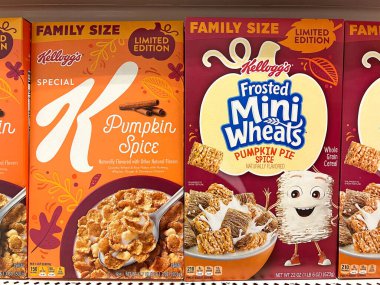 Alameda, CA - Sept 15, 2022: Grocery store shelf with boxes of Kellogg's brand cereals, Special K and Frosted Mini Wheats. Pumpkin spice and Pumpkin Pie Spice flavors added. Special holiday editions. clipart