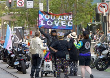 San Francisco, CA - June 30, 2024:  Dykes on Bikes preparing to kick off the 54th annual Gay Pride Parade going up Market. This years theme, Beacon of Love. clipart