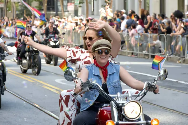 stock image San Francisco, CA - June 30, 2024:  Dykes on Bikes kicking off the 54th annual Gay Pride Parade going up Market. This years theme, Beacon of Love.