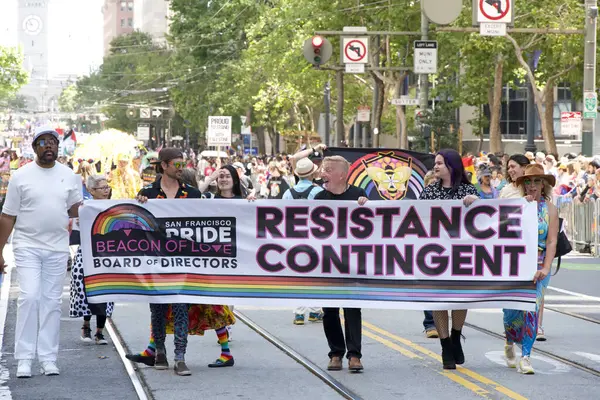 stock image San Francisco, CA - June 30, 2024:  Unidentified partiipants in  the 54th annual Gay Pride Parade going up Market. This years theme, Beacon of Love.