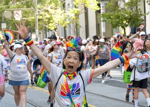 stock image San Francisco, CA - June 30, 2024:  Unidentified partiipants in  the 54th annual Gay Pride Parade going up Market. This years theme, Beacon of Love.