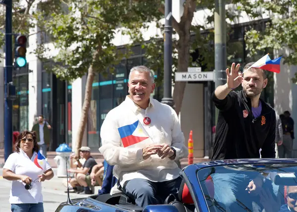 stock image San Francisco, CA - Aug 10, 2024: Supervisor Matt Dorsey and Danny Sauter participating in the 31st annual Pistahan Parade, a colorful display of Filipino community pride and diversity.