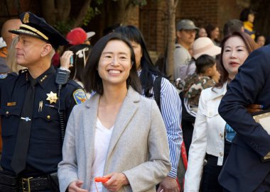 San Francisco, CA - Sept 14, 2024: Participants at the 34th annual Autumn Moon Festival. An occasion for outdoor reunions among friends and relatives to eat mooncakes, a symbol of harmony and unity. clipart