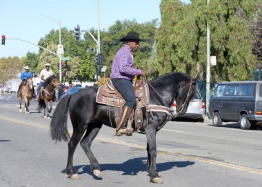 Oakland, CA - Oct 5, 2024: Participants in 50th annual Black Cowboy parade, hosted by the Oakland Black Cowboy Association, promoting the contributions of people of color to the Old West. clipart