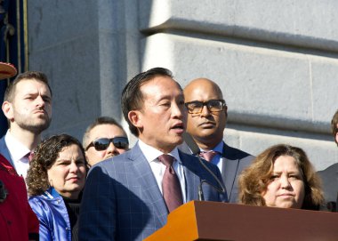 San Francisco, CA - Jan 28, 2025: City Attorney David Chiu speaking on the steps outside of City Hall re-affirming the cities ongoing status as a Sanctuary City clipart