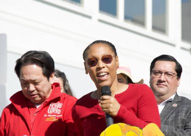 Oakland, CA - Feb 22, 2025:  Supervisor Rowena Brown speaking at the third annual lunar new year opening ceremony in Oaklands Chinatown. Year of the Snake.  clipart